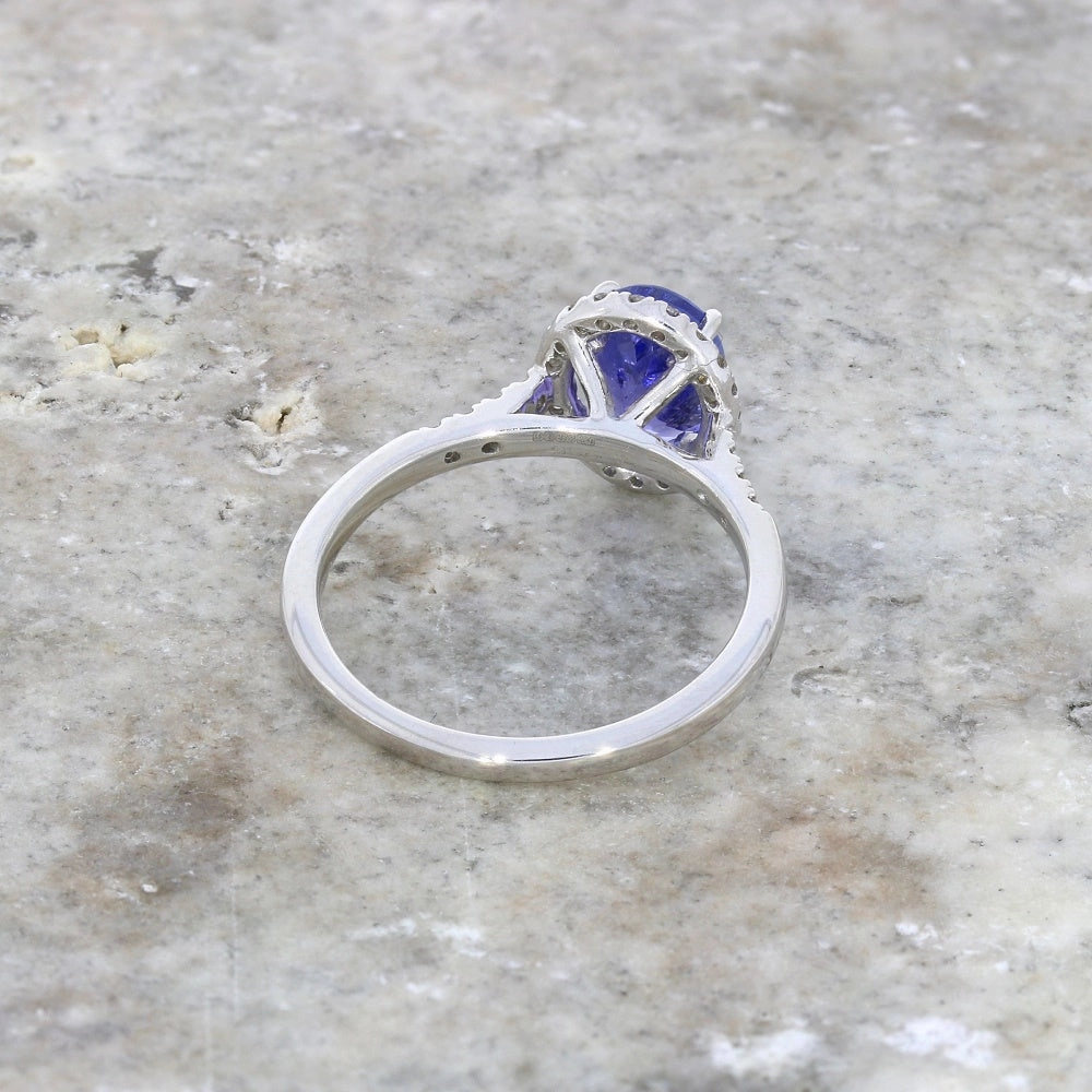 Pre Owned 9ct White Gold Oval Tanzanite and 0.20cts Diamond Halo Cluster Ring