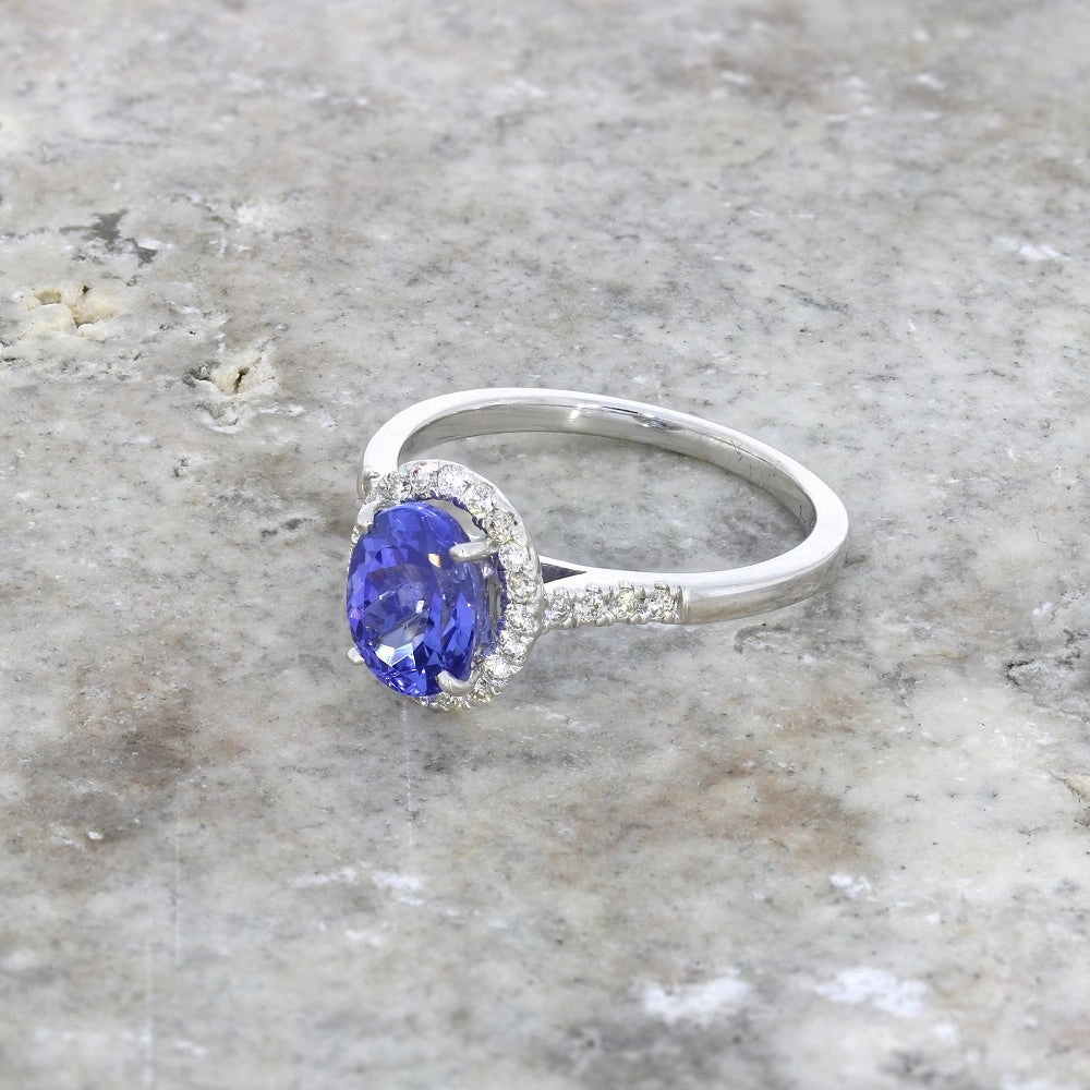Pre Owned 9ct White Gold Oval Tanzanite and 0.20cts Diamond Halo Cluster Ring